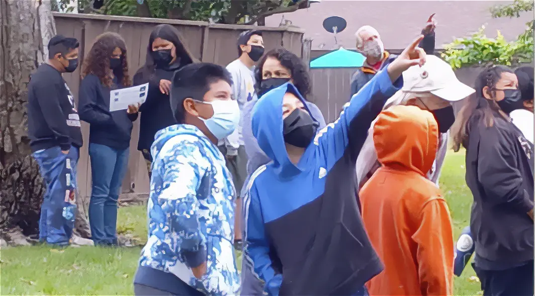 Students at Lincoln School look for herons