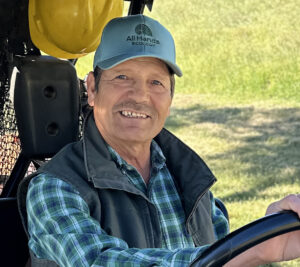 staffmember Tomas Ruiz sits in an ATV