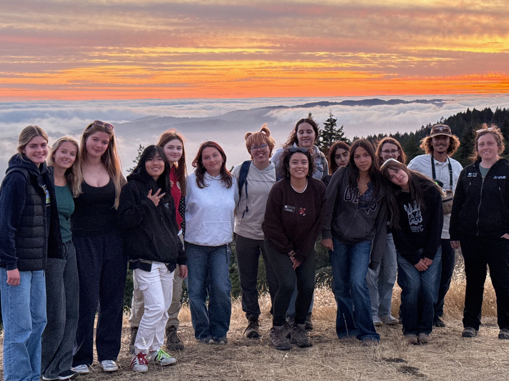 young people standing in a group at the top of a hill in Marin County