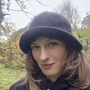 a close up of Melissa Kenworthy with vegetation in the background